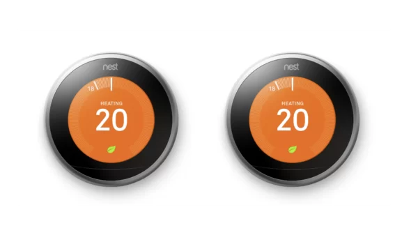 two nest learning thermostat displaying 20 with an orange screen